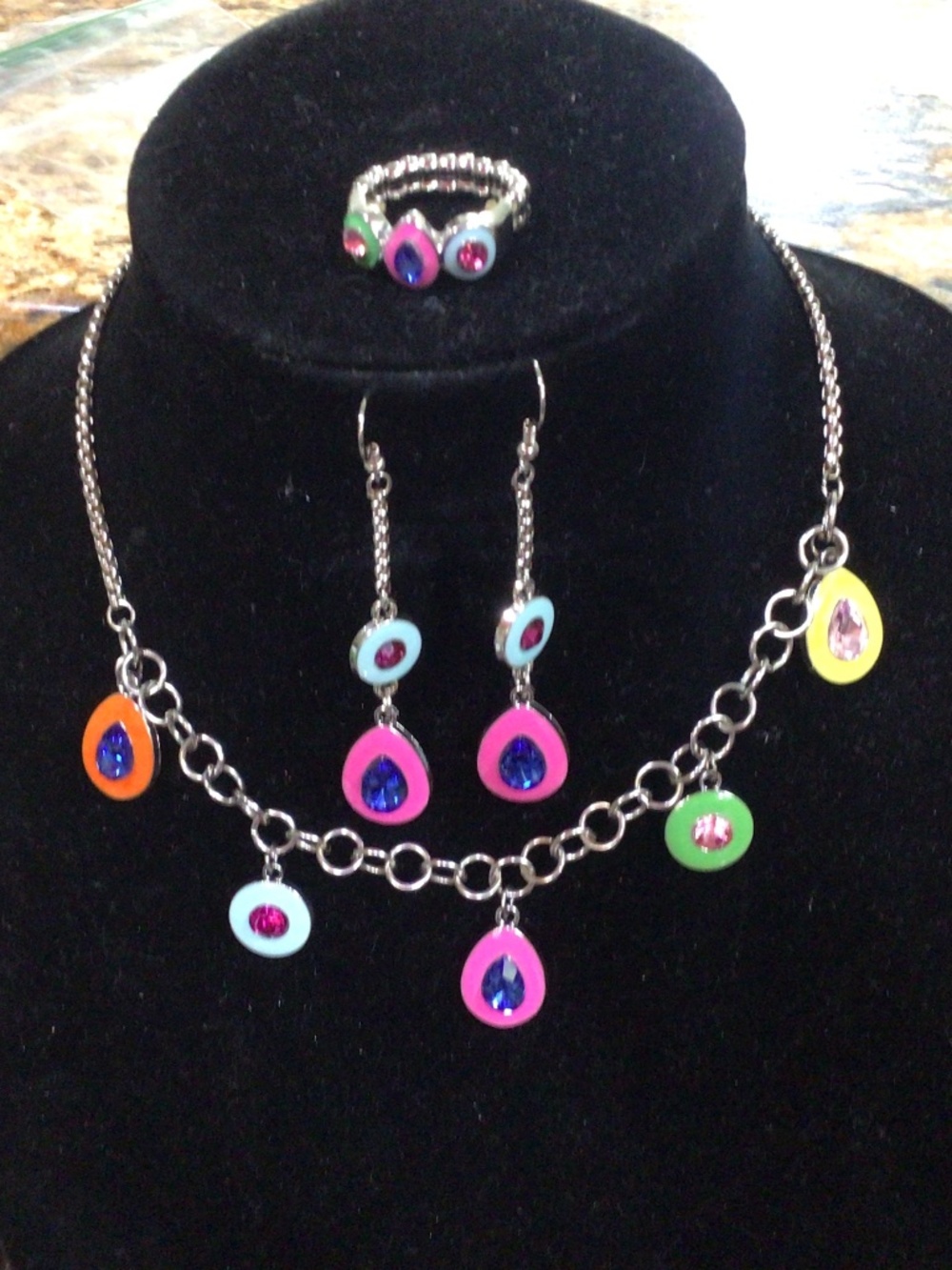 Cute, colorful and playful set. Necklace, earrings, and stretchy band ring